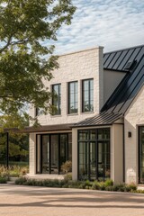 Modern architecture showcases a stylish home with large windows and a sleek design in a serene outdoor setting surrounded by greenery during daylight