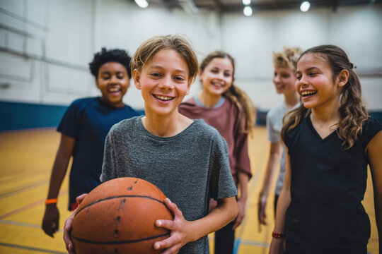 Group of cheerful students engage in basketball practice, showcasing teamwork and enjoyment in their school gym after classes - Powered by Adobe