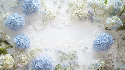 Pastel blue hydrangeas and white flowers arranged on lace fabric background.