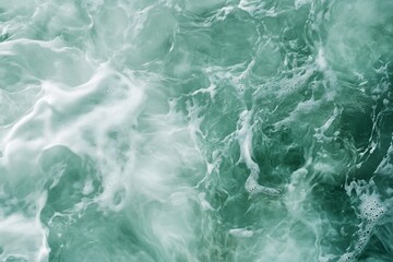Obraz premium Close-up of turquoise ocean water with white foam and waves.