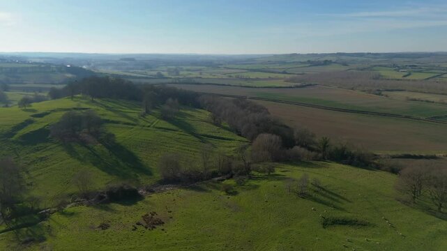 A sweeping aerial view of rural farmland in the United Kingdom