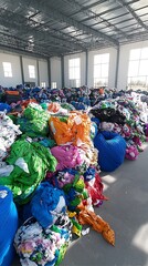 Colorful Fabric Scraps Stockpiled in Warehouse for Recycling