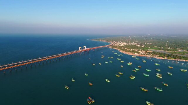 aerial footage of the Pamban Bridge stretching over the turquoise sea