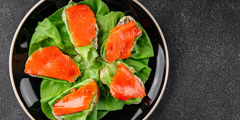 Salmon sandwich red fish seafood appetizer dish fresh tasty gourmet food background on table rustic food top view copy space pescetarian diet