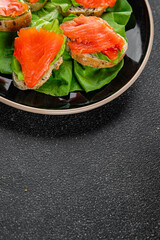 Salmon sandwich red fish seafood appetizer dish fresh tasty gourmet food background on table rustic food top view copy space pescetarian diet