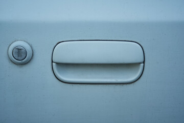 Close-up view of an old car door handle