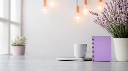 An inviting and cozy workspace showing a lavender mug alongside a pastel notebook and vibrant plant, reflecting a nurturing atmosphere for creative endeavors.