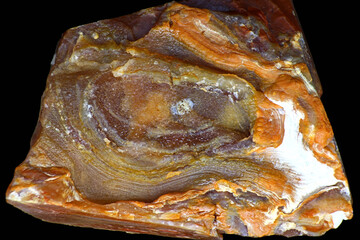 Pseudo-flow form of chalcedony on flint on a black background