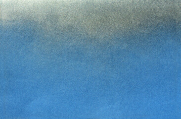 silver color spray paint gradient on blue color paper
