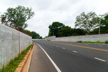 The road is paved with winding curves.
