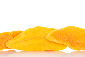 Dried mango slices isolated on white background, close-up.