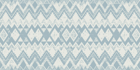 Textured blue and white tribal pattern with geometric shapes and natural motifs.