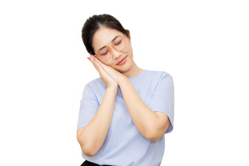 Fototapeta premium A woman in a light blue shirt is smiling gently while resting her head on her hands, conveying a sense of relaxation and tranquility.