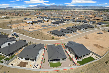 Aerial view of houses with mountains in the background