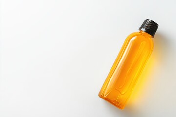 A clear plastic bottle of apple juice isolated on white background.