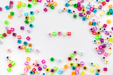 Child cubes and the word happy. Selective focus.