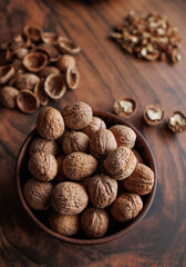 walnuts in a clay bowl. walnut shells