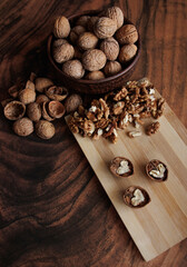 walnuts with shells and hazelnuts on the table