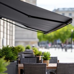 Elegant patio with table and chairs under a sleek retractable awning offering comfortable shade and stylish decor
