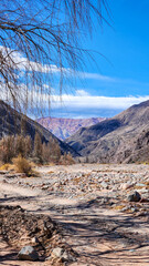 ERODED HILLS AND DRY RIVERBED IN THE QUEBRADA DE HUMAHUACA, ARGENTINA..