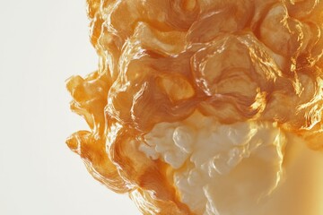 Abstract image of swirling, golden, and creamy textures resembling melted caramel or honey.