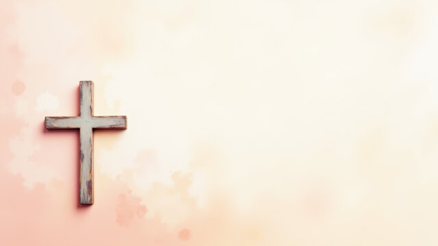 Wooden cross against a pink backdrop with bokeh lights.