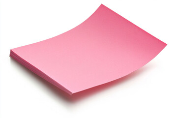 A stack of soft pink paper, ready for notes and ideas, promising a fresh start and creative possibilities with a bright, clean background.