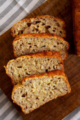 Homemade Banana Bread on a wooden board, top view. Close-up.