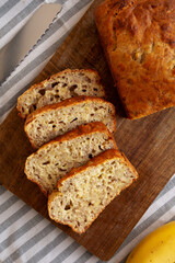 Homemade Banana Bread on a wooden board, top view. Close-up.