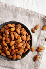 Roasted Almonds in a Bowl, top view. Flat lay, overhead, from above.