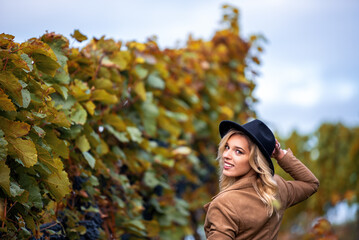 Smiling woman enjoying the autumn in a vineyard in Stuttgart, Germany