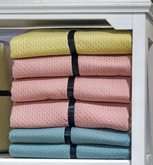 Colorful textile wrap covers inside shelf in house interior