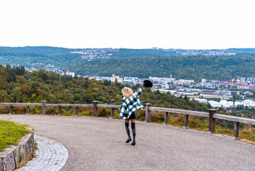 Woman getting away from city life in a public park on a hilltop in Stuttgart, Germany