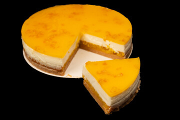 Orange cheesecake isolated on a white background.
