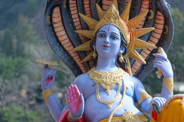 Portrait of a statue of Hindu God Vishnu in Rishikesh.