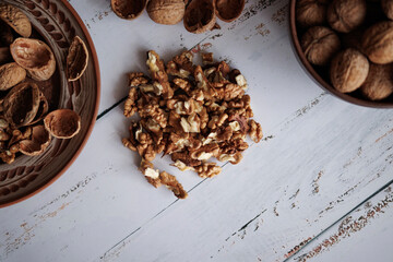 shelled walnuts on a white wooden table