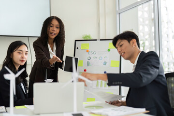 Collaborative ESG Discussion in a Corporate Environment. A team engages in brainstorming innovative solutions for sustainable practices.