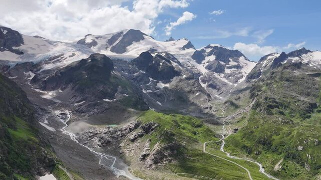 Flight towards Stein Glacier and mountain panorama seen from top of mountain pass Susten Pass in the Swiss Alps, Switzerland