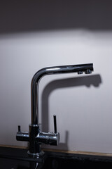 Sleek and Modern Kitchen Faucet Design: A Chrome Fixture Perfect for Contemporary Interiors