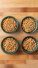 Fototapeta premium Four Bowls of Chickpeas on Wooden Board