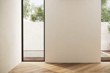 Empty minimalist room with natural light, wooden flooring, and a neutral wall, perfect for showcasing artwork or creative interior concepts. 3D render.