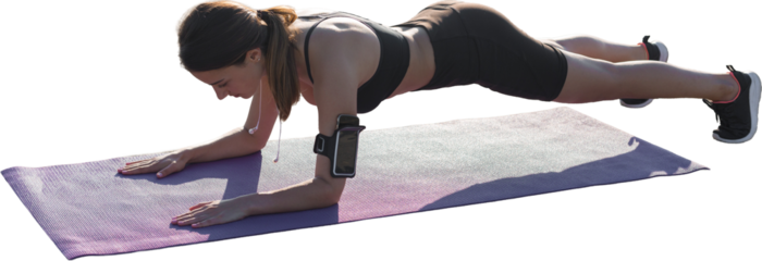 Young attractive woman doing exercise working out outdoors.