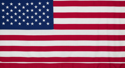 Fototapeta premium A majestic American flag, a symbol of freedom and unity, displayed with bold red and white stripes and a vibrant blue canton filled with stars.