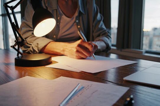 Woman taking notes at her workplace. Work life concept.
