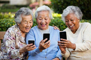 Group of Elderly Ladies Enjoying Smartphones in a Park Setting