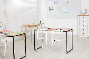 Classroom with desks, chairs and board. Interior design