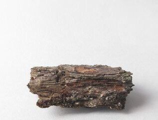 A natural podium made of wood with green moss for organic products on a white background. Space for copying.