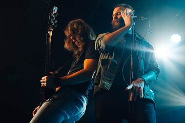 Rock band performing live on stage with passion and energy