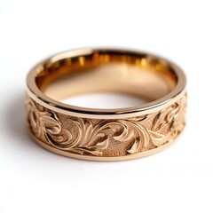 Close up of a gold ring with floral design isolated on white background
