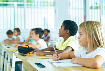 Side view of a group of elementary school students